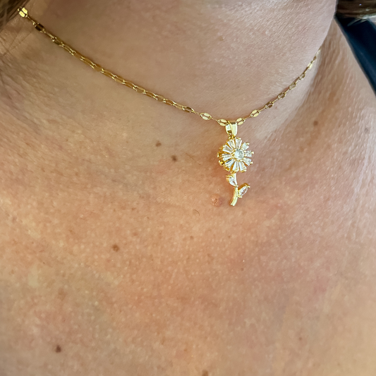 Collar flor giratoria - dorado