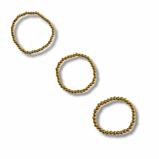Pulseras bolitas - elásticas - dorado
